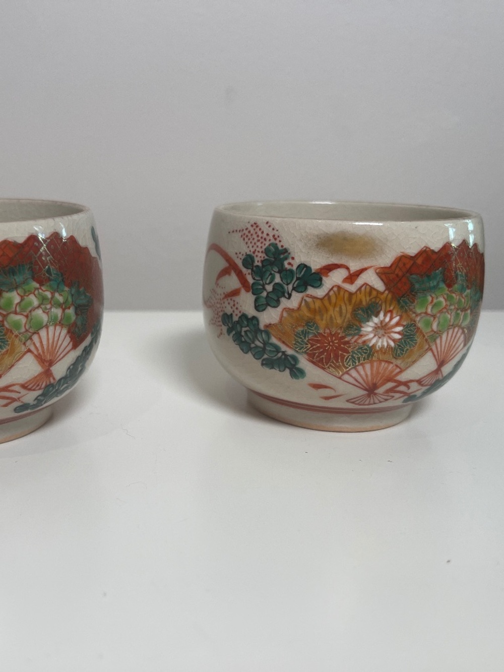 2 Japanese Kutani cups - fans and flowers theme -
